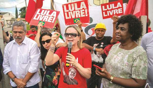 Brazilian Workers Party (PT) president and Parana state senator, Gleisi Hoffmann speaks to supporters of former president Luiz Inacio Lula da Silva outside the police headquarters in Curitiba, Brazil, yesterday.
