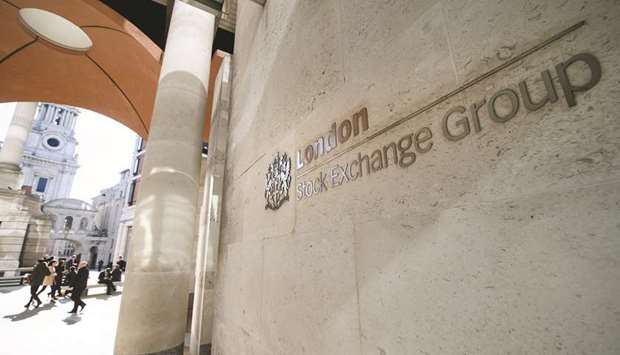 A sign is pictured on a wall outside the entrance to the London Stock Exchange. The FTSE 100 closed up 0.1% to 6,721.17 points yesterday.