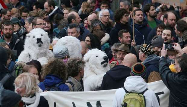 People take part in a march called ,Claim the Climate, demanding Belgian authorities to take action during the CAP24, in Brussels, Belgium