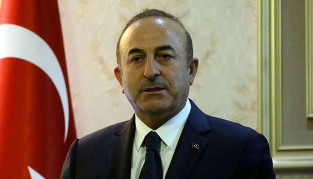 Turkish Foreign Minister Mevlut Cavusoglu speaks during a press conference with his Libyan counterpart at Mitiga International Airport near the Libyan capital Tripoli yesterday.