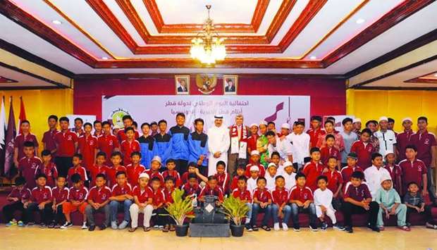 Qatar ambassador to Indonesia HE Ahmed bin Jassim al-Hamar with hundreds of orphans and their mothers during the QND celebration.