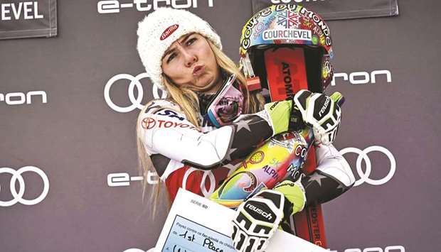 Mikaela Shiffrin celebrates on the podium after winning the FIS Alpine World Cup Women Slalom in Courchevel, French Alps. (AFP)