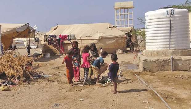 Yemeni children gather at a camp for displaced people in the Khokha district of the western province of Hodeidah. The central bank of Yemen, split into two rival head offices reflecting a country divided by war, has been slow to finance imports of food needed to fend off widespread hunger, sources with knowledge of the matter have told Reuters.