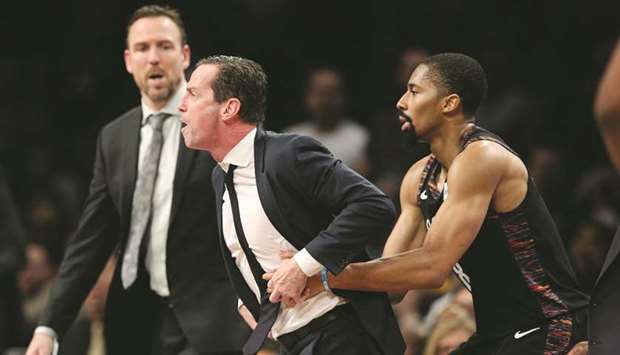 Brooklyn Nets coach Kenny Atkinson is restrained by point guard Spencer Dinwiddie (right) during the fourth quarter against the Indiana Pacers at Barclays Center. PICTURE: USA TODAY Sports