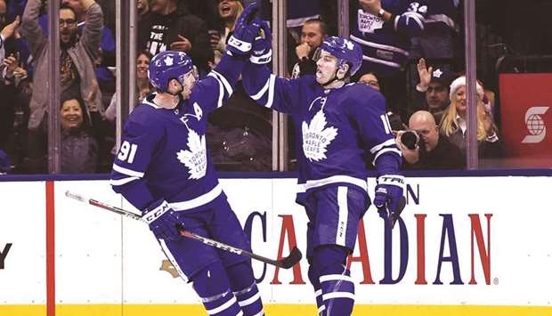 Toronto Maple Leafs forward Mitch Marner (right) is greeted by forward John Tavares after scoring against New York Rangers in the third period at Scotiabank Arena. PICTURE: USA TODAY Sports