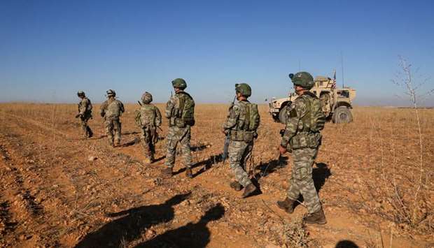 US and Turkish soldiers conduct the first-ever combined joint patrol outside Manbij, Syria on November 1, 2018.