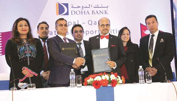 Dr Seetharaman and Poudyal with other executives during the e-remittance agreement signed between Doha Bank and Global IME Bank in Kathmandu recently.