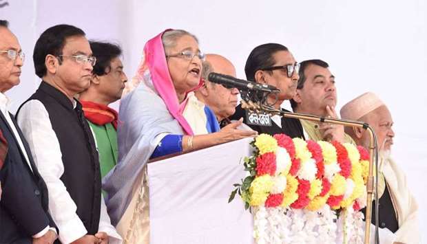 Bangladesh Prime Minister Sheikh Hasina (C) speaks during an election campaign rally in Dhaka