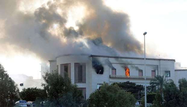 Smoke rises from the site of the headquarters of Libya's foreign ministry after suicide attackers hit in Tripoli