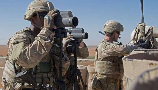 US Soldiers surveil the area during a combined joint patrol in Manbij, Syria on November 1, 2018.
