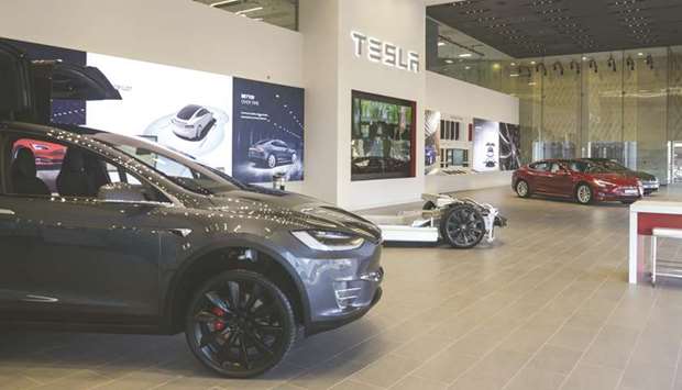 Electric cars sit on display at the Tesla showroom in Dubai. The economic benefits of electric cars ownership arenu2019t strong in the UAE, which has some of the cheapest gas prices in the world and some of the hottest weather.