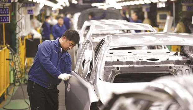 An employee works at an assembly line of Hyundai Motoru2019s plant in Asan, South Korea. The countryu2019s exports in December are likely to increase less than in the previous month due to cooling demand from major economies led by China, a Reuters survey found yesterday.