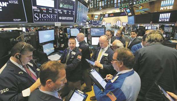 Traders work on the trading floor at the New York Stock Exchange (file). The flip side of whatu2019s been the third-worst month for American stocks in the postwar era is that prices are a whole lot cheaper than they were before the rout.