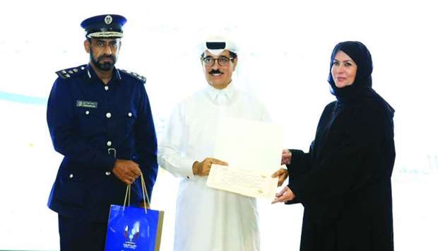 HE al-Kuwari presents a certificate as al-Marri looks on.rnrn