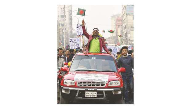 Supporters of Bangladesh Awami League taking part in a rally ahead of general election.