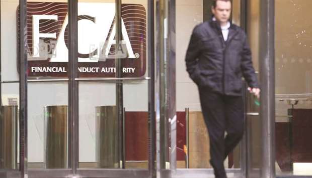 A visitor exits the offices of the Financial Conduct Authority in London (file). The total value of fines handed out by the FCA fell by almost 75% in 2018, after a bumper year.