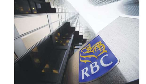 A signage is displayed outside the Royal Bank of Canada headquarters building in Toronto. RBC is the undisputed investment-banking powerhouse in Canada, with earnings and revenue topping its five other rivals in each of the past 13 years.
