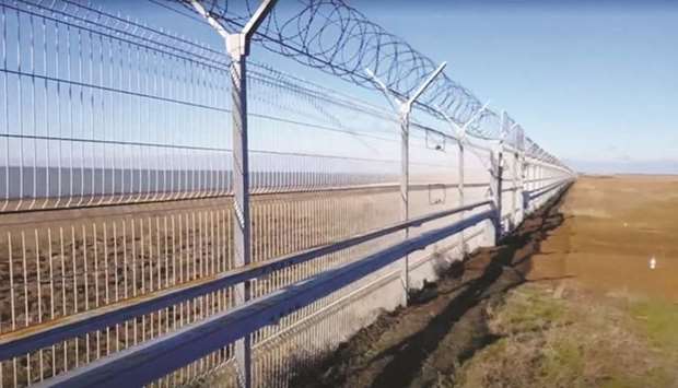 This still image taken from a video footage shows the 60km fence separating Crimea peninsula from continental Ukraine.