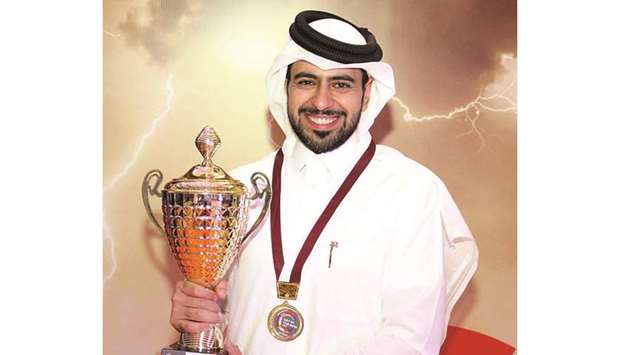 DISTINCTION: Mohamed al-Jefairi holds the trophy after winning the Get in The Ring competition in Singapore where he represented Qatar.