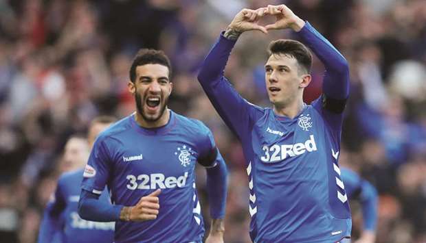 Rangersu2019 Ryan Jack (right) celebrates with Connor Goldson after scoring against Celtic during the Scottish Premiership match in Glasgow yesterday. (Reuters)