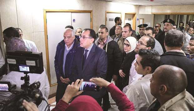 Egyptu2019s Prime Minister Mostafa Madbouli, centre, tours the hospital where Vietnamese victims of an attack on a tourist bus where taken in Al-Haram district in the Egyptian capital Cairou2019s western twin city of Giza yesterday.