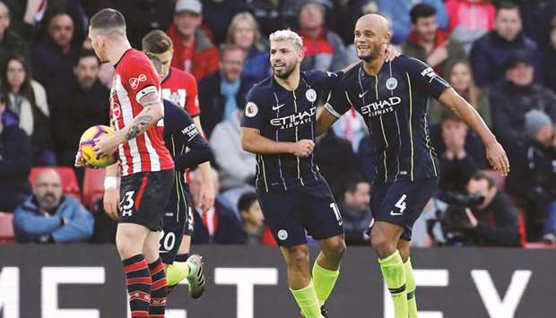 Manchester Cityu2019s Sergio Aguero (second right) celebrates with Vincent Kompany after scoring against Southampton in the Premier League. (Reuters)
