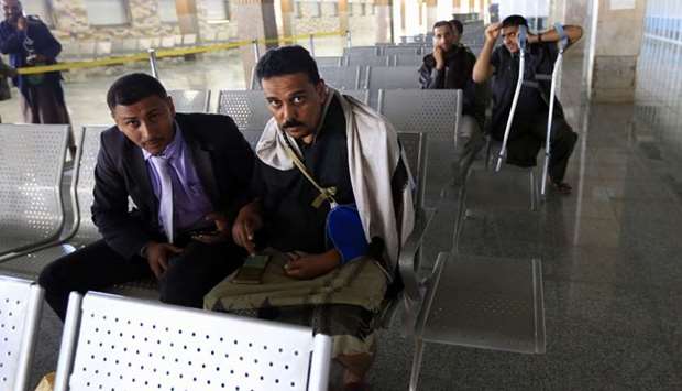Wounded Yemeni rebels await their evacuation to the Omani capital Muscat at the Sanaa International Airport.