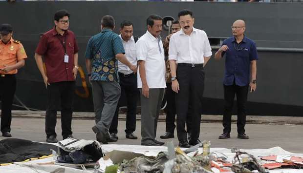 Rusdi Kirana, Lion Air Founder and owner (2-L) talk to Edward Sirait Lion Air CEO (3-L) during their visit to monitor the recovery process for the Lion Air flight JT-610 plane and crash victims at Tanjung Priok Harbour, Indonesia 30 October 2018. EPA