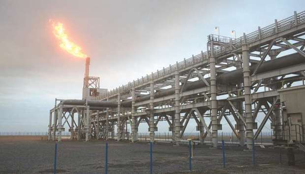 A gas flare, also known as a flare stack, burns at the Yamal LNG plant, operated by Novatek, in Sabetta, Russia (file). The $27bn Yamal LNG project is liquefying gas at all three of its planned production units, which were brought online within less than a year.