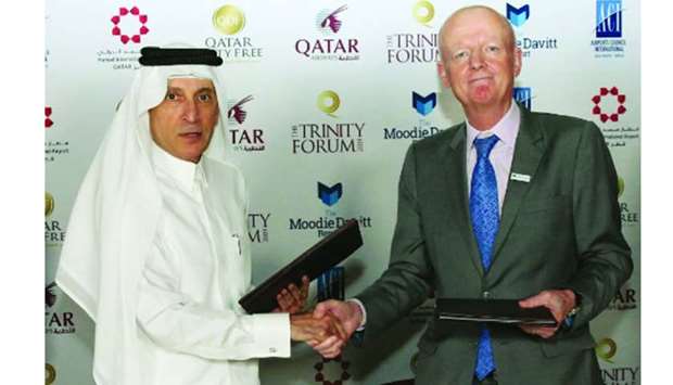 Qatar Airways Group chief executive Akbar al-Baker and The Moodie Davitt Report founder and chairman Martin Moodie shaking hands after signing the partnership agreement for the event.