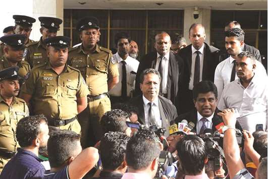 Sri Lankan Member of Parliament Ajeeth P Perera, second right, speaks to the media outside the Supreme Court in Colombo yesterday.