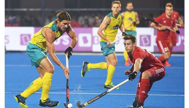Englandu2019s Ansell Liam (right) fights for the ball with Australiau2019s Jace Harvie (left) during their group match at the 2018 Hockey World Cup in Bhubaneswar yesterday. (AFP)
