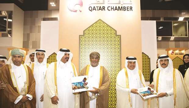 Qatar Chamber first vice-chairman Mohamed bin Towar al-Kuwari and second vice-chairman Rashid al-Athba presenting the book, Industryu2026Strategic Choice, to HE the Minister of Commerce and Industry Ali bin Ahmed al-Kuwari and Omanu2019s General Authority for Investment Promotion and Export Development president Yahia bin Saeed al-Jabri during the u2018Made in Qataru2019 exhibition in Muscat.