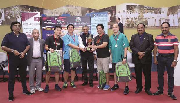 CHAMPIONS: Ambassador of India P Kumaran presenting the Overall Championship Trophy to Philippines team.