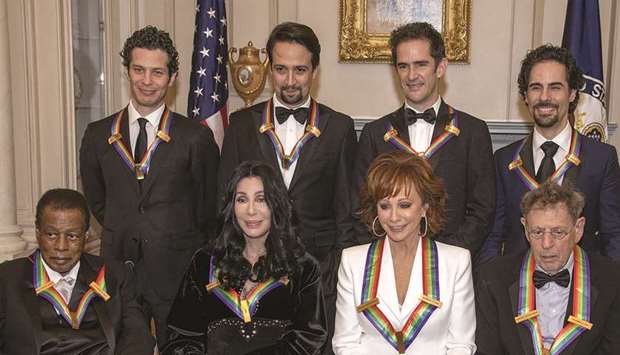 AWARDS: The recipients of the 41st Annual Kennedy Center Honors pose for a group photo.  From left to right back row: Thomas Kail, Lin-Manuel Miranda, Andy Blankenbuehler and Alex Lacamoire.  Front row, left to right: Wayne Shorter, Cher, Reba McEntire and Philip Glass.