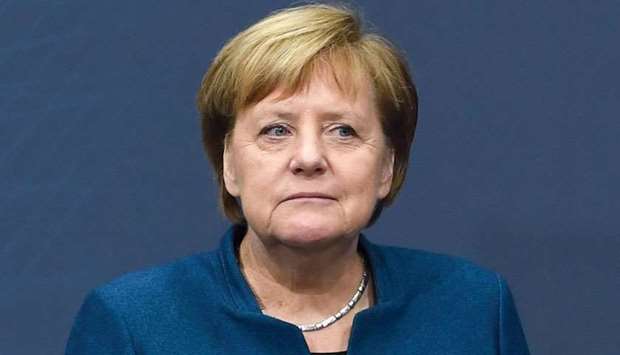 German Chancellor Angela Merkel attends a presentation during her visit at the trade fair Digital Summit (Digital Gipfel) in Nuremberg, southern Germany, on December 4.