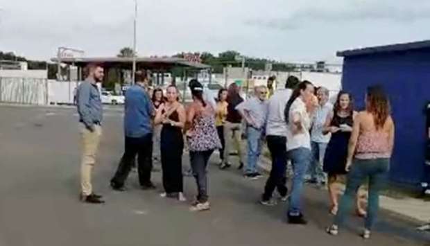 People gather outside during a quake evacuation in Noumea, New Caledonia December 5, 2018 in this still image taken from a video obtained from social media. Facebook/Jean Jacques Brunet/via REUTERS