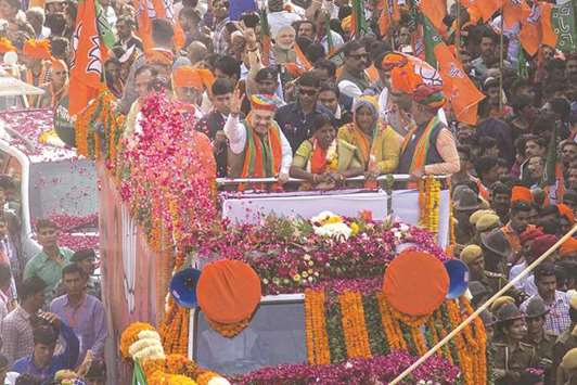 BJP chief Amit Shah takes part in a roadshow on the last day of campaign for Rajasthan elections, in Ajmer yesterday.
