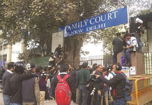 Journalists wait outside the Patiala House Court where British national Christian Michel James was produced by the CBI.