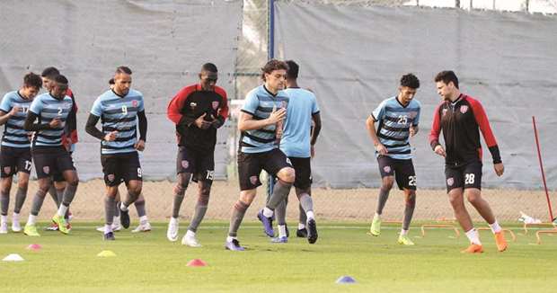 Al Duhail players train yesterday on the eve of their QNB Stars League match against Qatar SC.