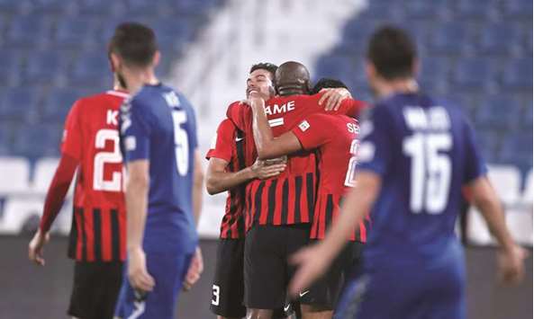 Al Rayyan players celebrate one of their goals against Al Kharaitiyat.