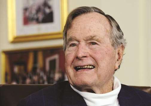 A file picture dated 15 July 2015, showing former US President George HW Bush in his office in Houston, Texas.