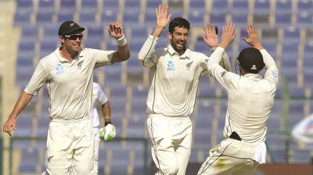 Will Somerville, centre, and Tim Southee, left, both took three second innings wickets as New Zealand bowled out Pakistan for 156.
