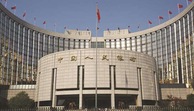 The Peopleu2019s Bank of China headquarters in Beijing. The PBoC has brought down interbank market rates and is pressing banks to keep lending to cash-starved companies, though lenders are reluctant to risk another spike in bad loans.