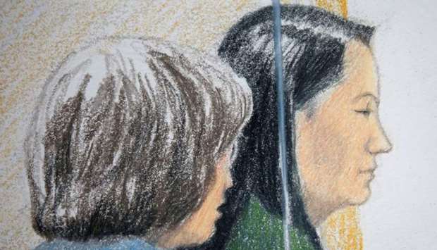 Huawei CFO Meng Wanzhou, who was arrested on an extradition warrant, appears at her B.C. Supreme Court bail hearing along with a translator, in a drawing in Vancouver, British Columbia, Canada