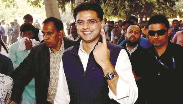 Rajasthan Congress president Sachin Pilot shows his inked finger after casting his vote for the state assembly elections, in Jaipur, yesterday.