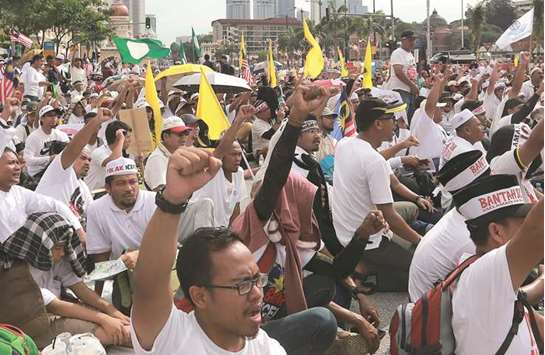 People take part in an Anti-ICERD (International Convention on the Elimination of All Forms of Racial Discrimination) mass rally in Kuala Lumpur yesterday.