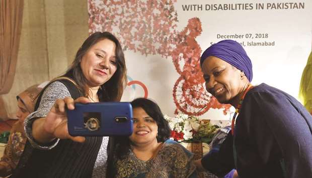 Mlambo-Ngcuka poses for a u2018we-fieu2019 with guests after a dialogue on harassment faced by women with disabilities in Pakistan, during her visit to Islamabad on Friday.
