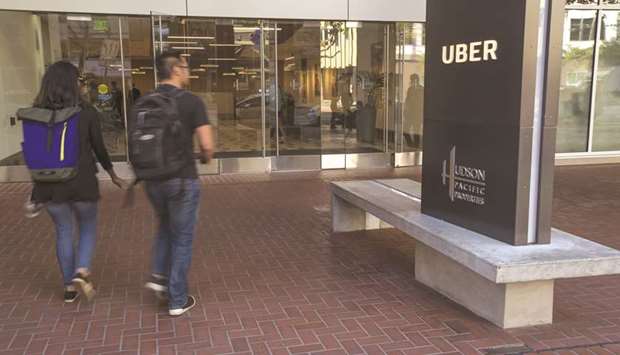 People arrive at the Uber Technologies headquarters in San Francisco (file). Uber has joined rival Lyft in filing for an initial public offering, according to a person familiar with the matter.
