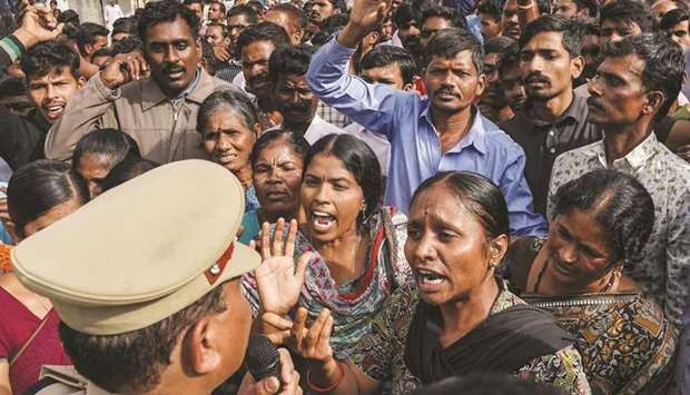 Demonstrators argue with a police officer during a protest yesterday in Shadnagar, on the outskirts of Hyderabad.